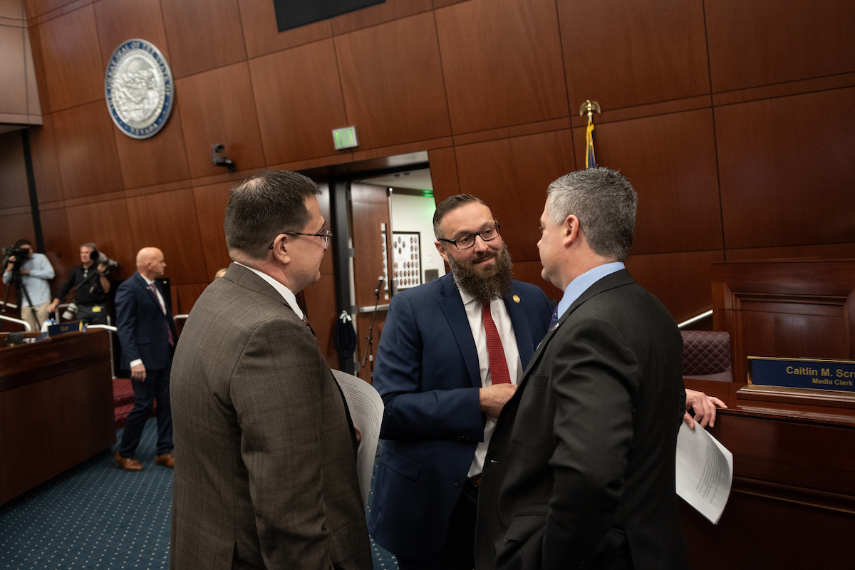 Minority Leader Gregory Hafen (R-Pahrump), center, speaks with Assm. Greg Koenig (R-Fallon), left, and Speaker Steve Yeager (D-Las Vegas) during the first day of the 83rd legislative session in Carson City.