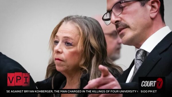 woman defendant and her attorney in court